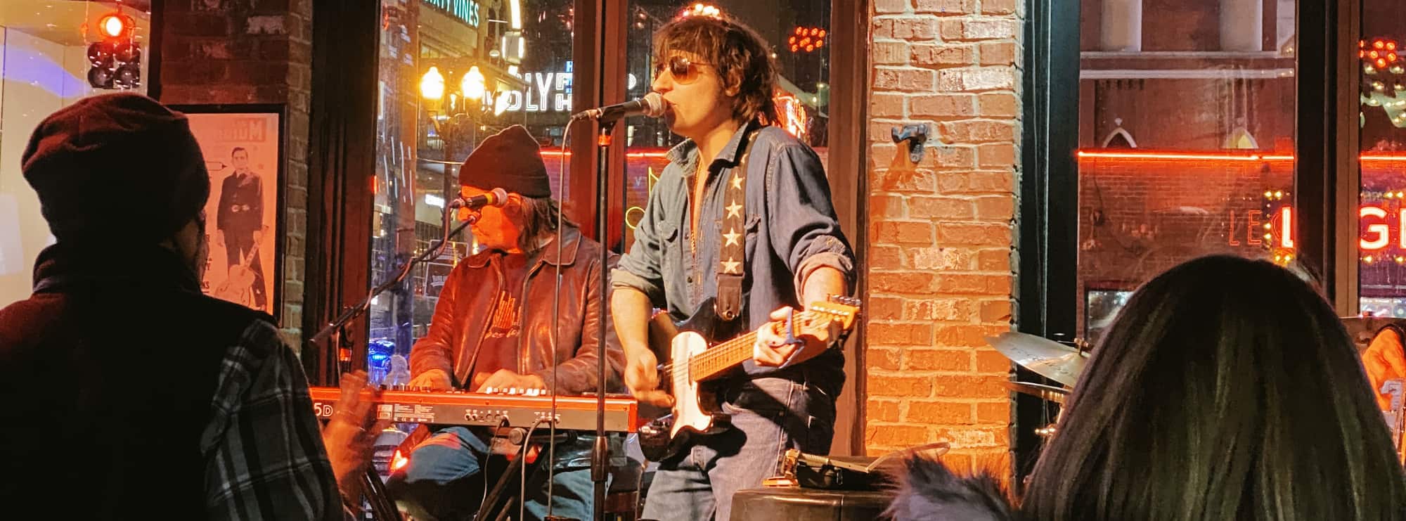 bar singer on guitar in Ann Arbor
