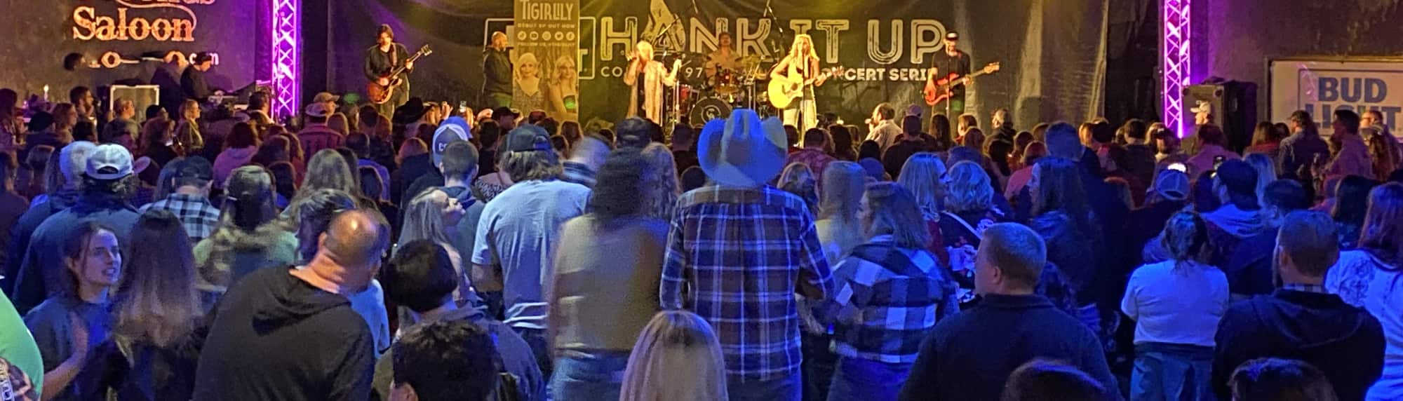 country concert with fans wearing cowboy hats Ann Arbor