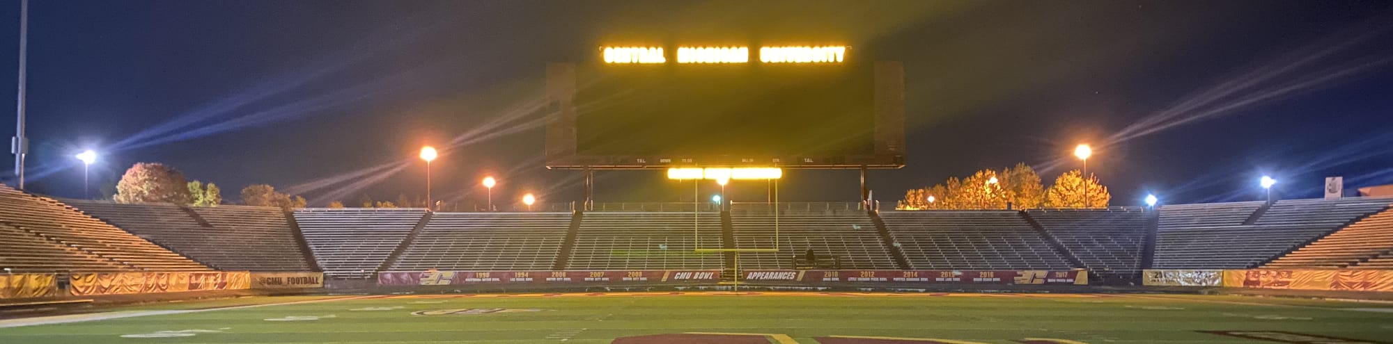 empty football stadium at night under the lights Ann Arbor