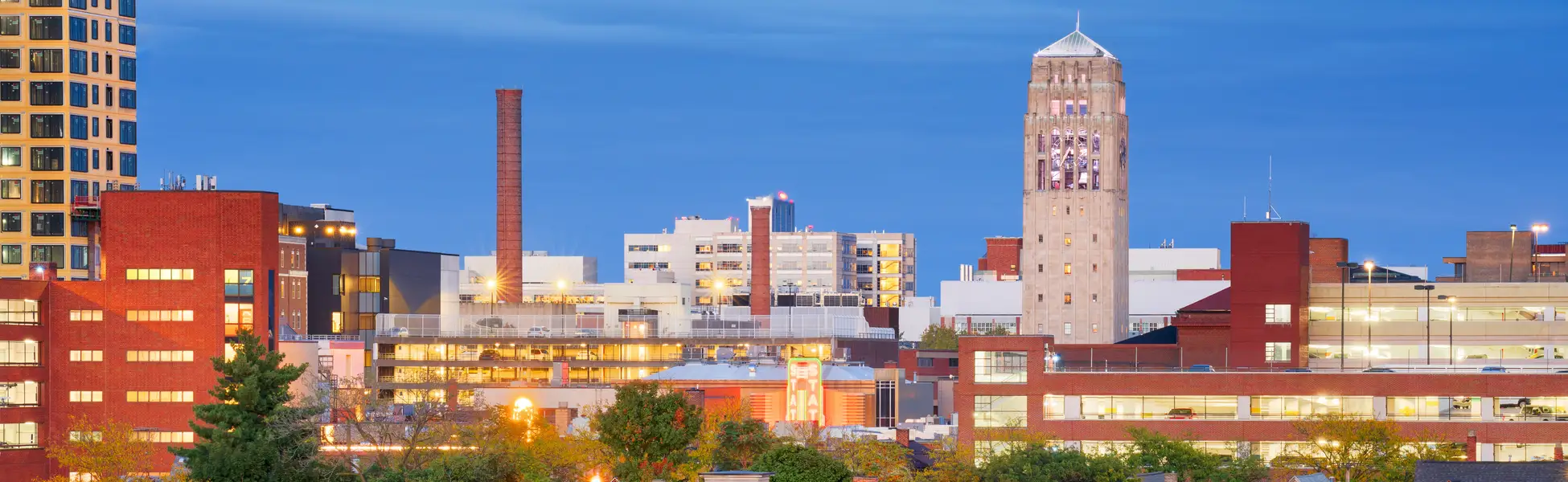 Neon color image of a band playing and people singing along